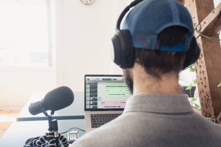 male podcaster editing his podcast episode